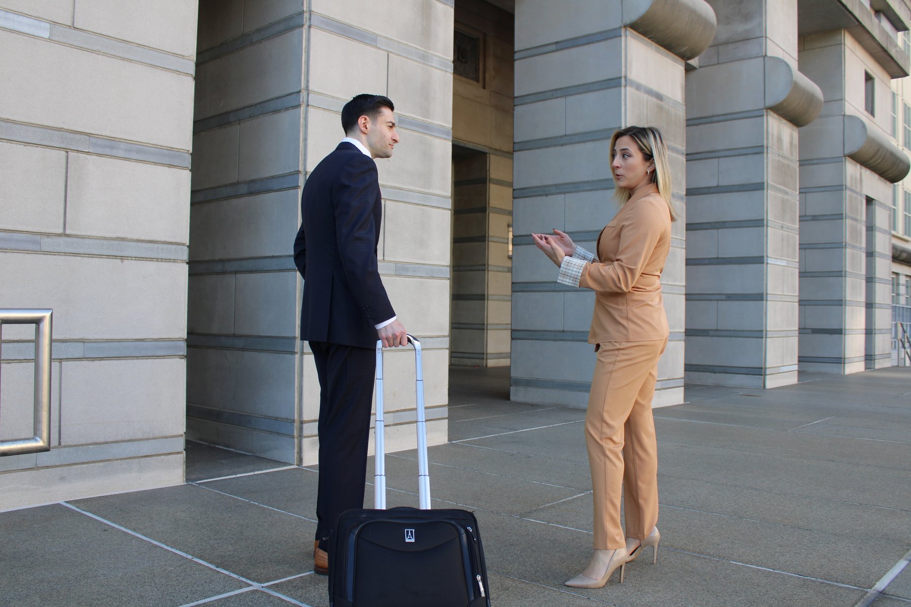 Brian Klein and Arlene Parra talking outside the courthouse