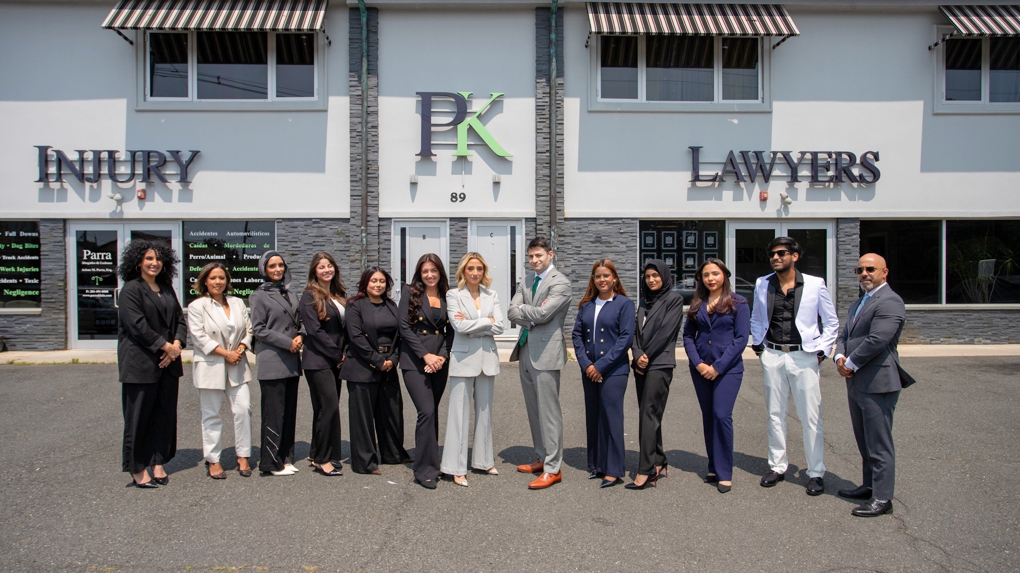 The Parra Klein team standing together outside the firm’s office at 89 US-46 in Elmwood Park